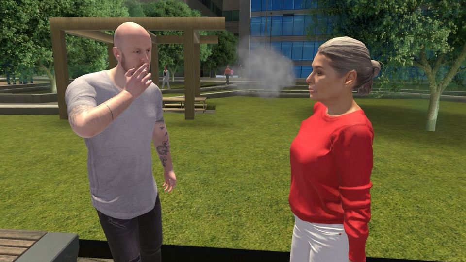 Une personne fume face à une autre dans un parc