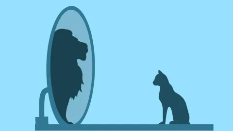 Silhouette d’un chat se voyant comme un lion dans un miroir