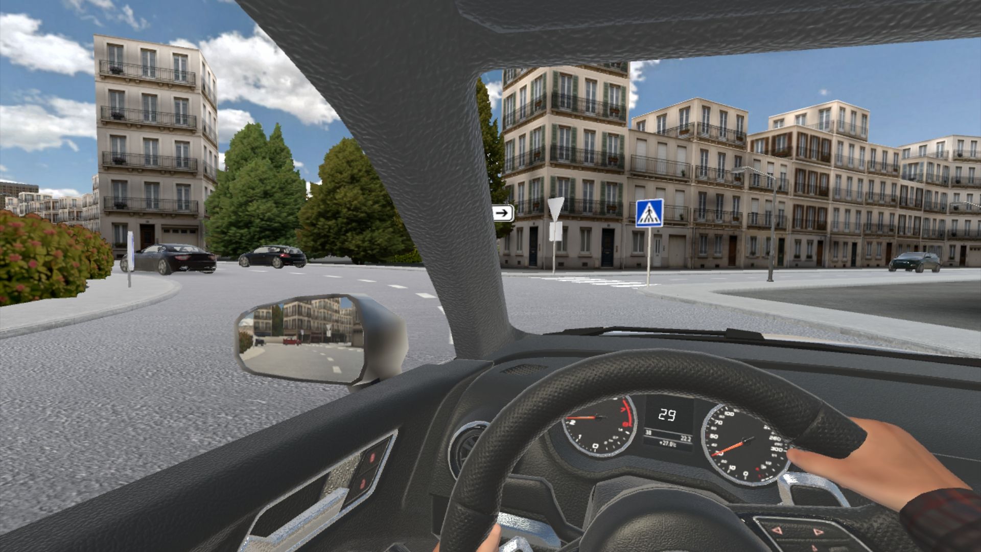 Vista al volante al acercarse a una rotonda urbana