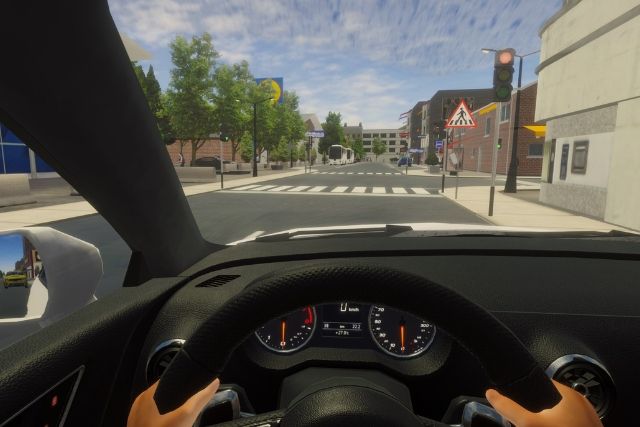 Conducción por una calle urbana con semáforo